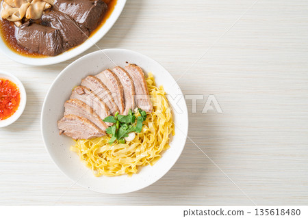 dried duck noodles in white bowl 135618480