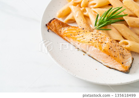 salmon with penne pasta cream sauce 135618499