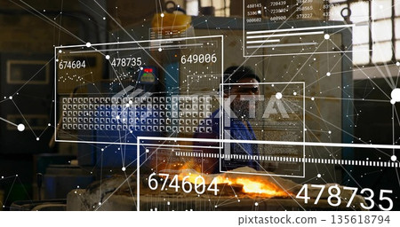 Technician wearing coveralls hard hat stirring molten metal at foundry with AR panels, copy space Technician wearing coveralls hard hat stirring molten metal at foundry with AR panels, copy space 135618794