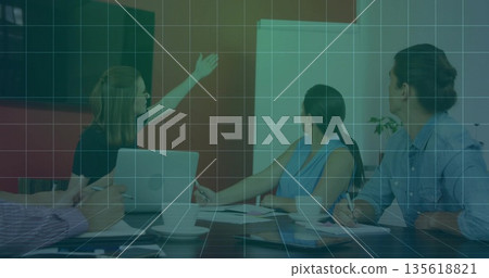 Gesturing presenter explaining plan using flipchart in office, with laptops, copy space Gesturing presenter explaining plan using flipchart in office, with laptops, copy space 135618821