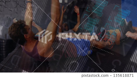 Woman in purple tank top and shorts crunching on exercise mats inside gym studio, copy space Woman in purple tank top and shorts crunching on exercise mats inside gym studio, copy space 135618871