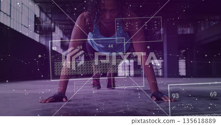 Holding athlete wearing workout clothes performing push-up in warehouse, with digital overlays Holding athlete wearing workout clothes performing push-up in warehouse, with digital overlays 135618889