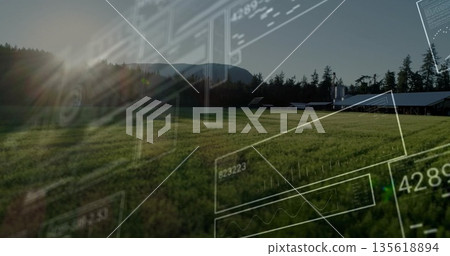 Showing farm building cluster sitting at tree line with grassy field and data graphics, copy space 135618894