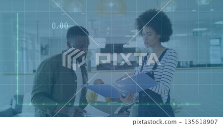 Reviewing striped shirt woman holding blue folder in modern open office, with monitors and desks Reviewing striped shirt woman holding blue folder in modern open office, with monitors and desks 135618907