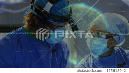Performing surgery two surgeons wearing blue scrubs, headlamps at OR, with loupes and drapes Performing surgery two surgeons wearing blue scrubs, headlamps at OR, with loupes and drapes 135618942