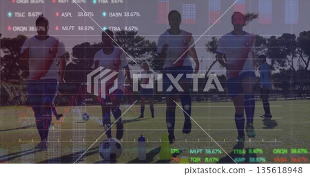Jogging female soccer team training on grass field, with cones, soccer balls and financial overlay Jogging female soccer team training on grass field, with cones, soccer balls and financial overlay 135618948