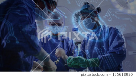 Performing surgery surgeons wearing blue gowns in operating room, with digital circuit overlay Performing surgery surgeons wearing blue gowns in operating room, with digital circuit overlay 135618950