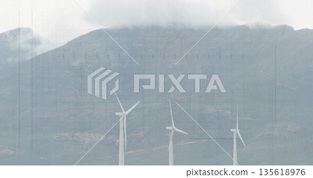Standing three wind turbines rotating blades on mountain hillside, with clouds and rocky ground Standing three wind turbines rotating blades on mountain hillside, with clouds and rocky ground 135618976