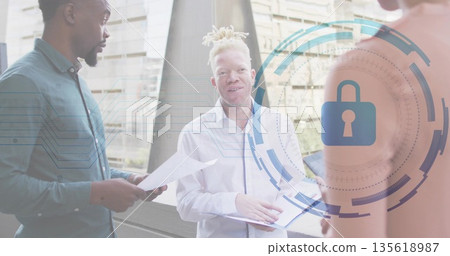 White-shirted woman discussing security on office balcony, holding open folder and padlock graphic 135618987