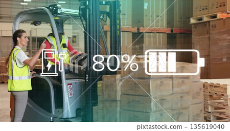 Warehouse staff wearing yellow vests monitoring electric forklift battery with overlay, copy space 135619040