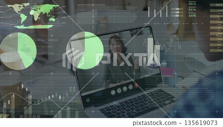 Laptop screen showing Asian woman gesturing in office, with interface icons notebooks pens overlays 135619073