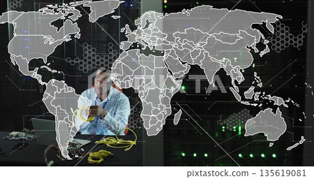 Technician in checkered shirt handling yellow Ethernet cables in tech lab, with laptop, copy space Technician in checkered shirt handling yellow Ethernet cables in tech lab, with laptop, copy space 135619081