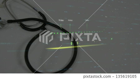 Showing black stethoscope at clinic desk with silver chest piece and green-yellow digital overlays Showing black stethoscope at clinic desk with silver chest piece and green-yellow digital overlays 135619105