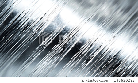 A silver object with a lot of lines and a shiny surface 135620282