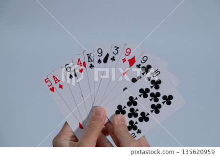 Playing cards in hand and copy space 135620959