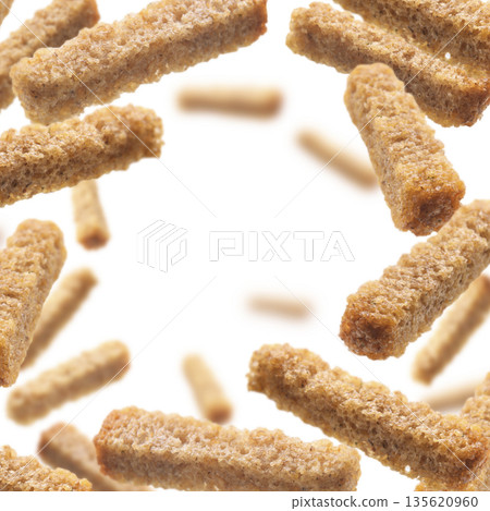 Bread croutons levitate on a white background Bread croutons levitate on a white background 135620960