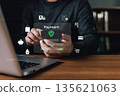 A person uses a smartphone for secure online payment with glowing digital icons of shopping, credit card, savings, tax, and healthcare, symbolizing financial technology and secure transactions. 135621063
