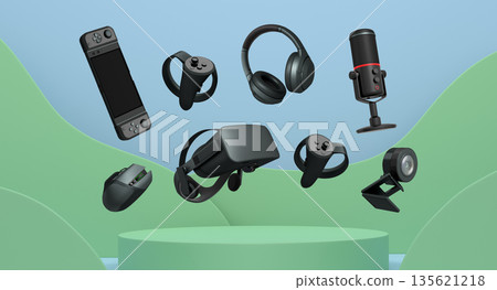 Assorted gaming gadgets like controllers, VR headset, mouse, and mic floating above circular podium and white platform 135621218