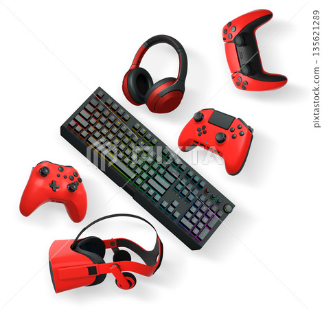 Gaming keyboard with RGB lighting, controllers, VR headset, and headphones isolated on white background with clipping path 135621289