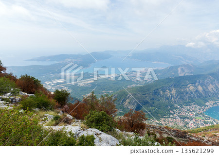 A sweeping hillside vantage captures a coastline and islands of Montenegro A sweeping hillside vantage captures a coastline and islands of Montenegro 135621299