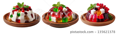 Bright red jelly salad dessert topped with fresh berries, mint leaves, marshmallows and candy isolated on white background Bright red jelly salad dessert topped with fresh berries, mint leaves, marshmallows and candy isolated on white background 135621378