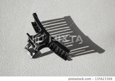 It's a black hair clip. 135621569