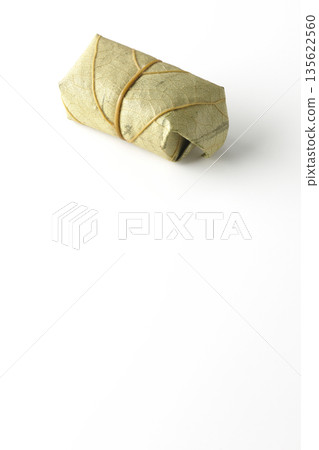 Persimmon leaf sushi photographed on a white background Persimmon leaf sushi photographed on a white background 135622560