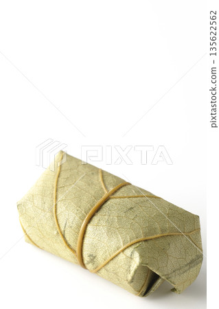 Persimmon leaf sushi photographed on a white background Persimmon leaf sushi photographed on a white background 135622562