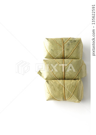 Persimmon leaf sushi photographed on a white background Persimmon leaf sushi photographed on a white background 135622591