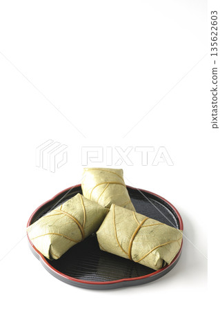 Persimmon leaf sushi photographed on a white background Persimmon leaf sushi photographed on a white background 135622603