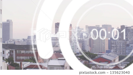 Displaying semi-transparent countdown graphic showing 00:01 over skyline at dawn, with rooftops 135623040