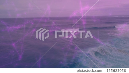 Showing expansive ocean surface rolling at sea, with white foam and purple network lines 135623058