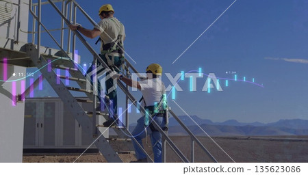 Climbing technicians wearing yellow hard hats on desert metal stairs with data overlay, copy space Climbing technicians wearing yellow hard hats on desert metal stairs with data overlay, copy space 135623086