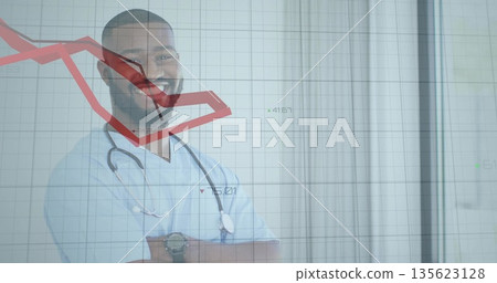 Smiling doctor wearing scrubs and stethoscope in clinic behind panel, with descending red chart Smiling doctor wearing scrubs and stethoscope in clinic behind panel, with descending red chart 135623128