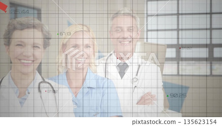 Smiling medical team wearing lab coats in hospital room, with stethoscopes and numeric overlay 135623154