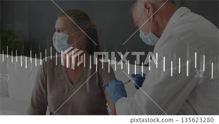Administering doctor injecting vaccine into woman on sofa with face masks, syringe and waveform 135623280