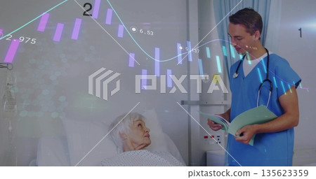 Patient lying in hospital bed gazing up at medical professional holding chart, with IV stand 135623359