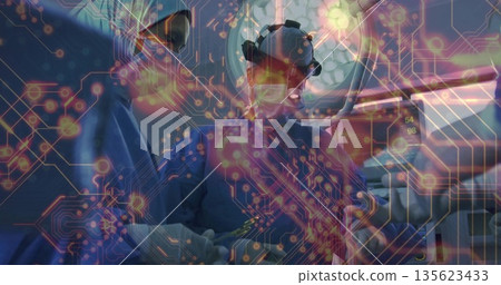 Two surgeons wearing scrubs performing surgery with forceps in OR, with glowing circuit overlay Two surgeons wearing scrubs performing surgery with forceps in OR, with glowing circuit overlay 135623433