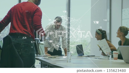 Group of four colleagues collaborating around table in meeting room, viewing network projection 135623480