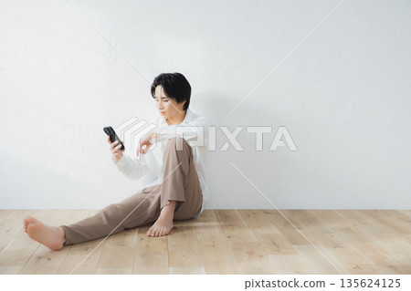Men sitting on the floor Men sitting on the floor 135624125