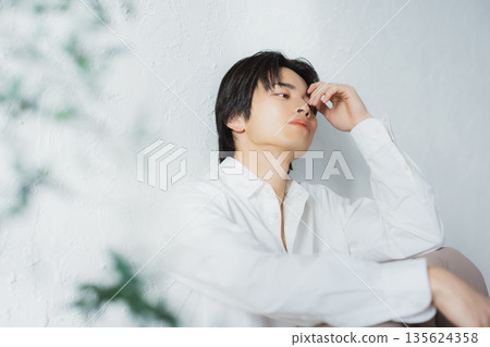 Men sitting on the floor Men sitting on the floor 135624358