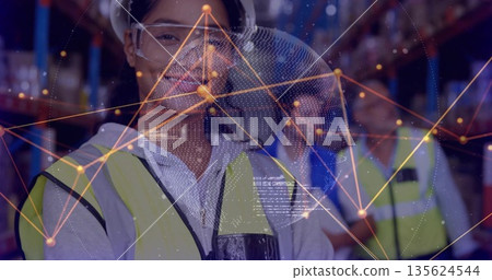 Monitoring logistics worker scanning network overlay in warehouse racks, with hard hat and headset 135624544