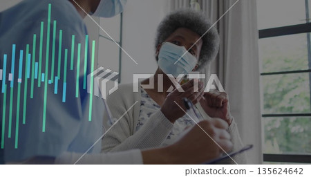 Patient wearing cardigan and mask inspecting vial in clinic, with nurse holding clipboard and pen Patient wearing cardigan and mask inspecting vial in clinic, with nurse holding clipboard and pen 135624642