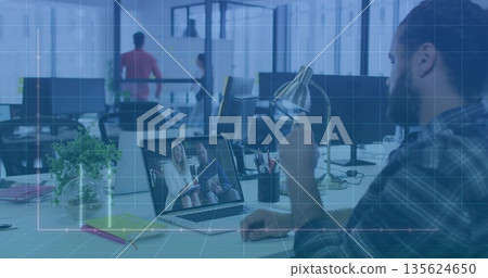 Holding smartphone joining online call plaid-shirted man at office desk using laptop, copy space Holding smartphone joining online call plaid-shirted man at office desk using laptop, copy space 135624650