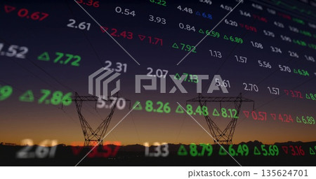 Featuring two transmission towers with lines in field at dusk with floating red green stock numbers 135624701