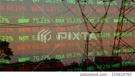 Showing high-voltage transmission tower silhouette against dusk sky with streaming market tickers Showing high-voltage transmission tower silhouette against dusk sky with streaming market tickers 135624765