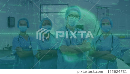 Standing medical team wearing blue scrubs and stethoscopes in hospital room, with digital overlay Standing medical team wearing blue scrubs and stethoscopes in hospital room, with digital overlay 135624781