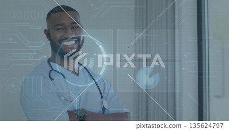 Smiling doctor wearing stethoscope and smartwatch standing in clinic with data overlay, copy space 135624797