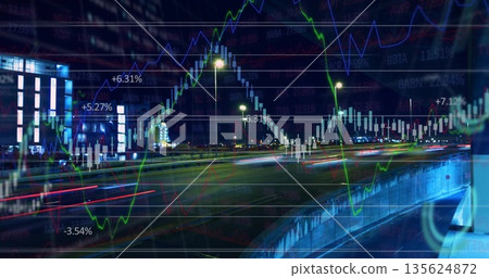 Displaying candlestick overlay spanning multi-lane night highway, with red and white light trails 135624872