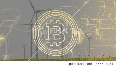 Floating Bitcoin symbol graphic hovering over grassy wind farm, with turbines and circuit rings 135624931